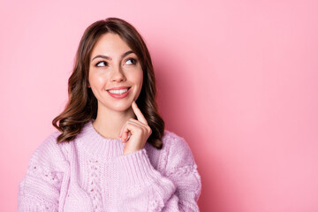 Fototapeta premium Portrait of attractive cheerful wavy-haired girl creating solution copy space ad isolated over pink pastel color background