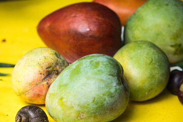 Mango on table under tree, vegetarian