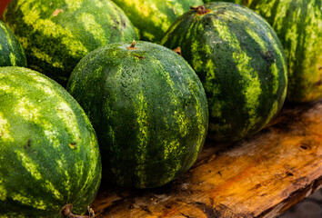 fresh watermelon with dew on wooden table
