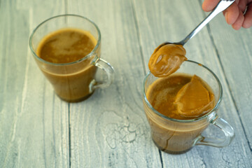 Dalgon coffee in beautiful glass cups with milk