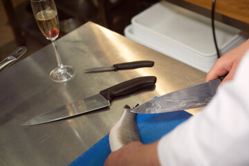 Fresh sea fish on a kitchen board in a restaurant
