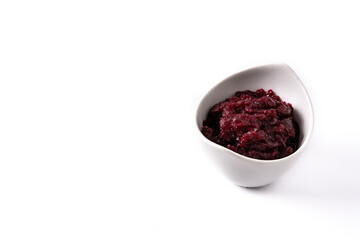 Beetroot sauce in white bowl isolated on white background. Copy space