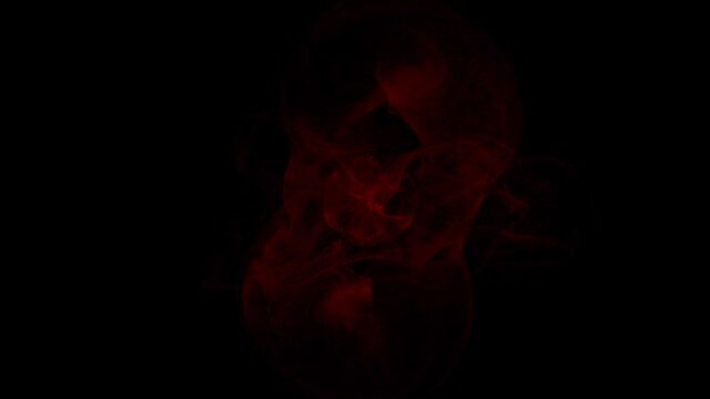 Red smoke moving on black background and explosion 4k footage