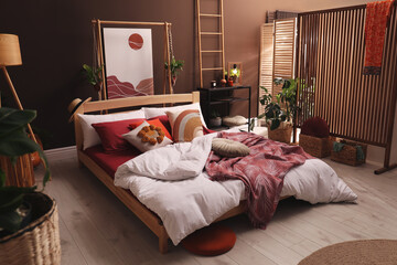 Modern interior of stylish room with large comfortable bed