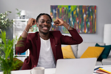 Smiling happy employee, boss of the company, wins tender, contract, earned big money, raises hands...