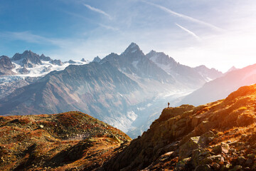 Obraz na płótnie Canvas Amazing view on Monte Bianco mountains range with tourist on a foreground. Vallon de Berard Nature Preserve, Chamonix, Graian Alps. Landscape photography