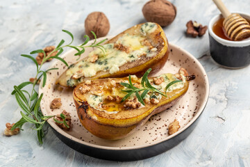 Pears baked with blue cheese, nuts, honey. Food recipe background. Close up