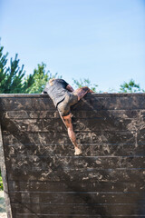 OCR run the woman climbs over the obstacle