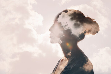 Psychology and woman mental health and weather dependent concept. Multiple exposure clouds and sun...