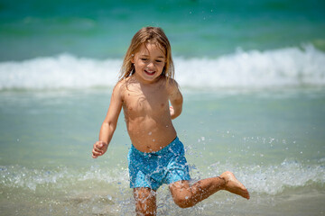 Happy Little Boy on the Beach