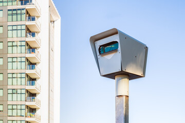 Modern stationary red light and speed camera in Adelaide city on a day
