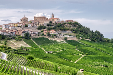 Fototapeta na wymiar The medieval village of La Morra, surrounded by its Nebbiolo's vineyards. Hilly region of Langhe (Piedmont, Northern Italy), UNESCO site since 2014, during summer season