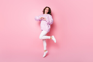 Full length body size view of lovely slim cheerful wavy-haired girl jumping showing heart shape...