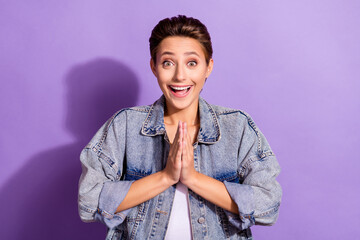 Photo of young amazed shocked woman clap hands anticipation good mood isolated on purple color background