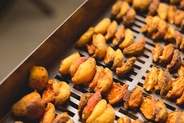 The process of home cooking dried fruits in an electric dryer.