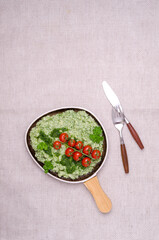Mashed potatoes with tomatoes and green sauce