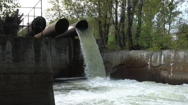 Industrial waste flows into the river