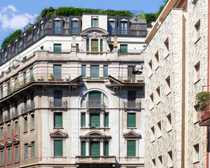 attention to detail in the facades of historic buildings from the early 1900s in the center of Milan, Italy