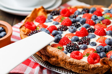 Fresh Berries Tart With Cream On Plate. Side View, Close Up.
