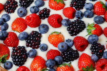 Fresh Berries In Cream Or Yoghurt, Or Milk Background. Flat Lay, Close Up.
