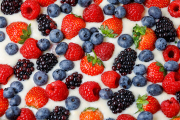 Fresh Berries In Cream Or Yoghurt, Or Milk Background. Flat Lay, Close Up.