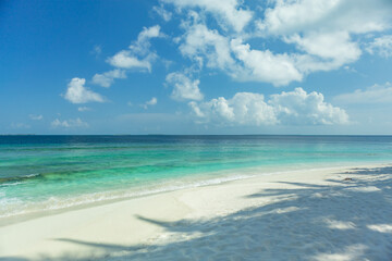 Maldives beach clear sand and sea water with blue sky