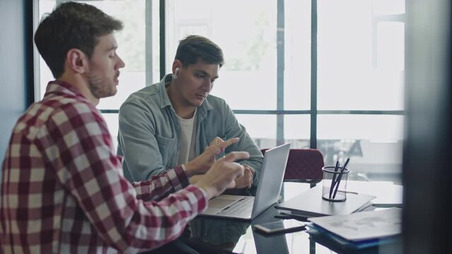 Male marketologists working on project together, teamwork in pr agency, startup