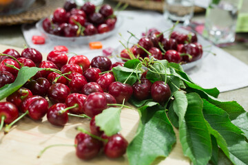 still life of cherries on a table in the yard