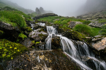 Obraz premium mountain creek in Valais in the mist