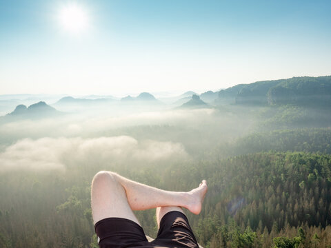 First person view to resting hiking legs,resting during hike.