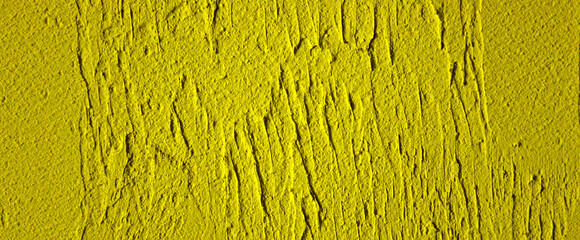 Yellow abstract background with plaster texture. Empty surface. Back for design.