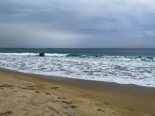 beach and cloudy sky on a rainy day in summer