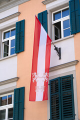 Austrian flag blowing in the wind at the old town of Bregenz on a sunny summer Sunday. Photo taken...