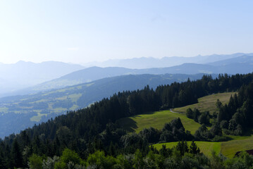 Beautiful scenic mountain panorama seen from local mountain Pfänder on a sunny summer day. Photo taken August 15th, 2021, Bregenz, Austria.