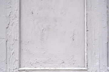 The texture of a wooden wall painted with white paint