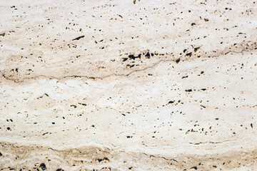 the texture of natural stone in a beige shade is similar to marble.