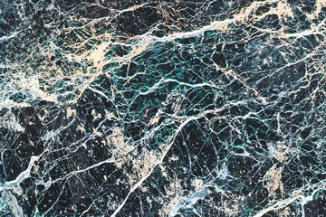 Marble stone texture with varied pattern with fine lines.