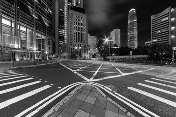 Empty street in downtown district of Hong Kong city at night