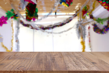 Jewish festival of Sukkot. Traditional succah (hut) with decorations. Empty wooden old table for...