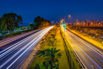 Car lights on the Mediterranean coast highway in Alanya at night, Turkey