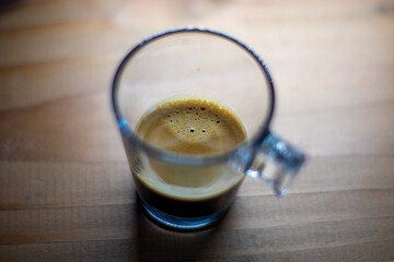 espresso in a glass cup on wood