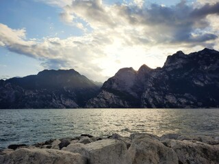 Fototapeta na wymiar Sunlight on lake and mountains