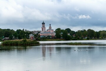 Fototapeta na wymiar Russia, Valdai, August 2021. View of the city from the other side of the lake.