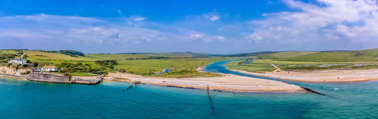 An aerial panorama view towards Cuckmere Haven, UK in early summer
