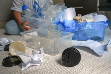 Garbage Sorting garbage onto glass, sheets and paper at home Garbage recycling, pollution proof,...