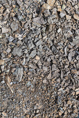 A beautiful texture of gray broken stone. Vertical