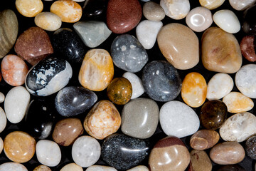 Polished beach pebbles. Nature background image with natural color pattern