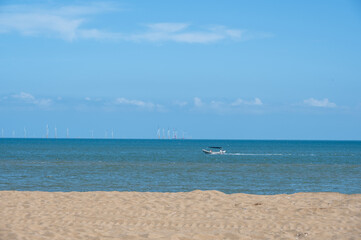 Fototapeta na wymiar Blue sky, green sea and golden beach
