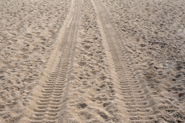 Long tire marks on the beach