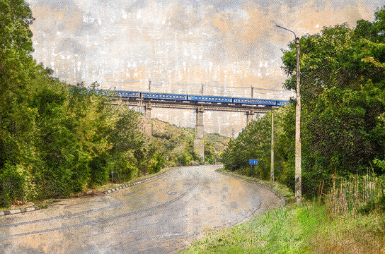 Road in the mountains with a railway bridge on top. The train pa